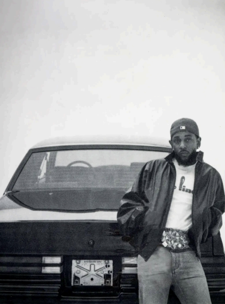 LAMAR STANDS beside his black Grand National